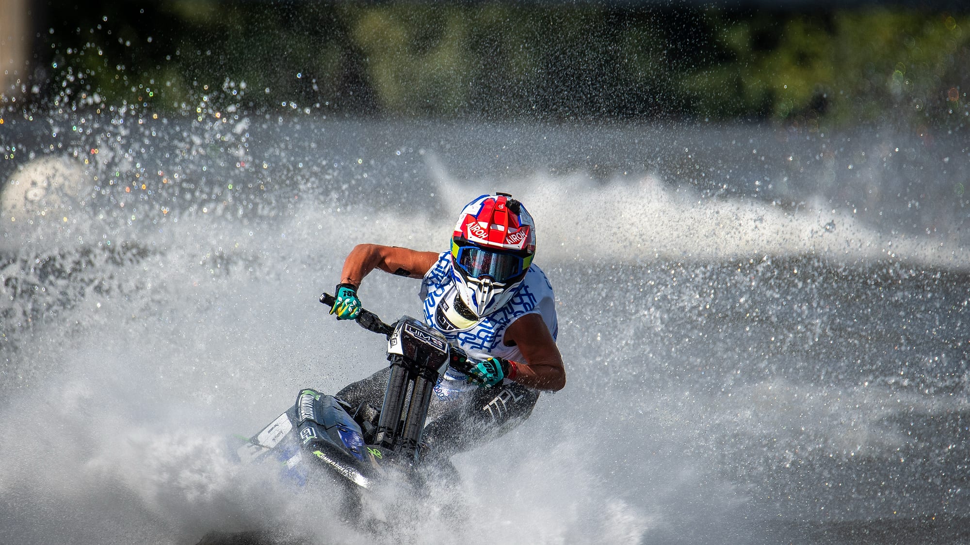 Jet ski riding through the spray